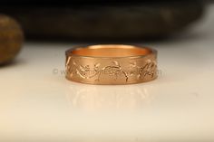 This listing is for THE depicted ring • The ring band is 6 mm in width and 1.2 mm in thickness • It is low profile with smooth interior edges. • I bright cut the design by hand with a wide and narrow angle engraver • Made in100% USA recycled 14kt rose gold • This ring is Ready To Ship size 8.5, it cannot be sized. If a custom size is required or it needs to be resized I can custom make one in your specific size. • I personally hand make all of my jewelry in my workshop in Great Barrington, Massa Great Barrington, Ring Band, Pine Cones, Rose Gold Ring, Low Profile, Or Rose, Band Rings, My Jewellery, Gold Rings