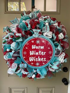 a wreath with the words warm winter wishes on it