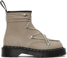 Ankle-high suede boots in taupe. Round toe. Modified tonal lace-up closure. Zip closure at inner side. Logo webbing pull-loop in black at heel collar. Signature topstitching in white at welt. Treaded platform rubber Air Cushion sole in black. Silver-tone hardware. Approx. 1.5 platform.Part of the Rick Owens x Dr. Martens collaboration.Supplier color: Pearl The Rick, New Closet, Glam Rock, Rick Owens, Suede Boots, Lace Up Boots, Luxury Streetwear, Black Silver, Silver Tone