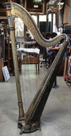 a large metal harp sitting on top of a floor