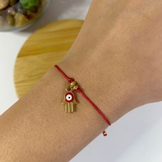 This handmade bracelet with evil eye charm protects the person wearing it from evil spirit and jealousy around them It is perfect for everyday look and as a gift for your loved ones ! ------Materials------ Gold Hamsa Hand Eye Charm 4 colours Nylon Cord, Red, Green, Pink, Blue 6 Sizes adjustable bracelet Kids, XS, S, M, L, XL -----How to order----- 1) Measure your Wrist and choose a size that fit you 2) Pick your colour  3) Add to your card and Submit an order  WHOLESALE QUANTITIES AND PRICES AVI Red Evil Eye Bracelet For Good Luck, Red Evil Eye Bracelet Gift, Adjustable Evil Eye Charm Bracelet Gift, Minimalist Evil Eye Bracelet For Gift, Minimalist Evil Eye Bracelet As Gift, Red Spiritual Evil Eye Bracelet As Gift, Evil Eye Charm Bracelet Gift, Spiritual Evil Eye Bracelet As Gift, Nazar Bracelet