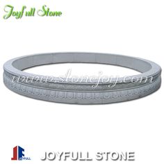 the joyful stone bracelet is made from white marble and has an intricate design on it