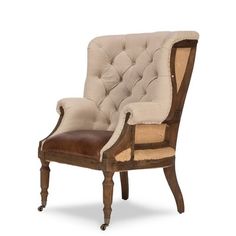 an old fashioned chair with leather upholstered on the back and armrests