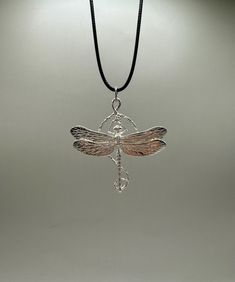 Gorgeous dragonfly pendant. For bug and insect lovers. This is a unique work done all by a passionate artist from design, production, and finish. This pendant is included with a black waxed cord necklace(18in). **Note: Pictures are enlarged to show detail. All pendants are packaged and shipped in a cotton baggy inside a water and tear-resistant bubble wrap envelope. If you have any questions about this item or any other items listed in our shop please do not hesitate to contact us.** Made out of Nickel Free Adjustable Dragonfly Necklace, Adjustable Sterling Silver Dragonfly Necklace, Note Pictures, Dragonfly Necklace, Dragonfly Pendant, Bugs And Insects, Cord Necklace, Bubble Wrap, Random Stuff