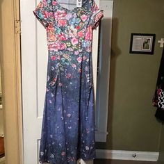 A Beautiful Blue Floweral Dress. Never Been Worn. Got Two Of The. I Accidentally Ordered Two Of Them. I Thought I Would Try And Sale One On Here Instead Of Sending Back. It’s A Beautiful Causal Dress For Church, Picnic Or A Walk On The Beach. Modest Blue Floral Print Dress, Pink Stretch Maxi Dress With Floral Print, Stretch Blue Maxi Dress With Floral Print, Floral Print Stretch Maxi Dress With Short Sleeves, Stretch Floral Print Maxi Dress With Short Sleeves, Casual Purple Floral Print Maxi Dress, Modest Fitted Floral Print Dress, Casual Stretch Dresses With Floral Print, Fitted Multicolor Floral Casual Dress