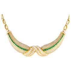 Prepare to be impressed by the elegance of this exceptionally luxurious collar necklace. It is expertly crafted in rich 18K yellow gold and finely detailed with 11 carats of diamonds and 3.85 carats of vibrant green emerald gemstones. The necklace measures 12 inches long and is fastened by a secure box tab clasp.Offered in estate condition, this 18K Yellow Gold 11.0ct Diamond and 3.85ct Emerald Necklace comes with a gift box. Luxury Yellow Gold Emerald Necklace For Celebration, Luxury Hand Set Emerald Necklace In Yellow Gold, Luxury Handmade Yellow Gold Emerald Necklace, Luxury Yellow Gold Teardrop Emerald Necklace, Luxury Faceted Yellow Gold Emerald Necklace, Multi Sapphire, Emerald Necklace, Yellow Gold Setting, Gold Brooches