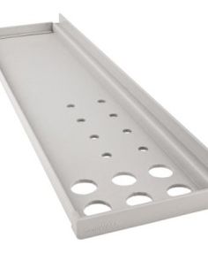 a white plastic shelf with holes in it