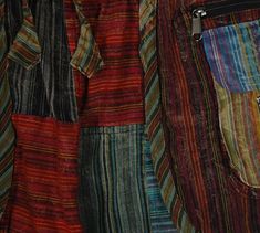 multicolored striped fabric with zippers hanging from it's sides and zipped pockets