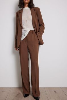 These suit pants feature a high waist with a zipper, hook and button closure. They have a belt loop and straight legs. These suit pants feature side slanting pockets and a back mock pocket. Inseam length in size 36: 81 cm / 31.88 in. Brown Office Pants With Pressed Crease, Office Dress Pants For Fall, Straight Fit, Office Straight Dress Pants For Fall, Office Dress Pants For Fall, Office Wear Straight Dress Pants For Fall, Brown Dress Pants With Pressed Crease For Work, Fall Office Dress Pants In Straight Cut, Brown Wide Leg Pants With Belt Loops For Work, Tailored Brown Wide Leg Pants For Work