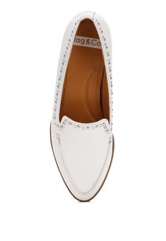 A refined classic style, the loafers are accentuated with the stud embellishments which add just the right touch of minimalistic oomph. The comfortable cushion insole cuts strain which make these loafers ideal for daily work wear.Type : LoafersUpper Material: Genuine LeatherOuter Sole: RubberClosed Almond ToeStud EmbellishmentsLow Block HeelHeel Height: 1 inchMetallic Sling DetailComfortable Cushion InsoleRCSH484 Style: Formal Embellishment: Stud Closure: Slip-on Heel Height: 1 inch Made In: ChinaMaterial Composition: Genuine Leather Elegant Pointed Toe Slip-ons With Brogue Detailing, Formal Studded Leather Loafers, Formal Leather Loafers With Studs, Formal Leather Studded Loafers, Formal Slip-on Loafers With Studs, Elegant Wingtip Moccasins For Spring, Elegant Spring Wingtip Moccasins, Elegant Studded Round Toe Loafers, Elegant Studded Loafers With Round Toe