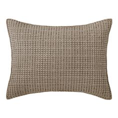 a brown and white pillow on a white background