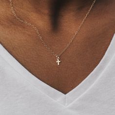 This Tiny Cross Necklace is a symbol of timeless elegance and grace.  Delicately crafted and designed for layering, this dainty piece adds a touch of spirituality to your everyday style.  Wear it alone for a subtle statement or layer it with other necklaces to create a personalized and chic look.  The refined craftsmanship ensures a delicate touch, making it a versatile accessory that effortlessly complements any outfit. Embrace the beauty of simplicity with our Tiny Cross Necklace - a symbol of both fashion and faith. DETAILS:  🖤 14k gold filled or sterling silver chains 🖤 14-20 inch options 🖤 add a tiny cross, moon or star charm in 14k gold filled or silver plated brass size 7-8 mm 🖤 lead and nickel free Free US shipping, 30 days for returns or exchanges, and a 1 year warranty on all Minimalist 14k Gold Cross Necklace With Delicate Chain, Dainty Yellow Gold Cross Necklace With Adjustable Chain, Dainty 14k Gold Cross Necklace With Delicate Chain, Everyday 14k Gold Filled Cross Pendant Necklace, Dainty 14k Gold Cross Necklace, Dainty Cross Jewelry With Delicate Chain, Dainty Cross Necklace For Everyday Wear, Gold Cross Necklace With Dainty Chain, Dainty Yellow Gold Cross Necklace For Everyday