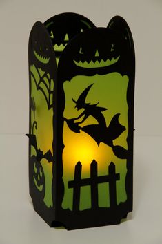 a paper lantern with a bat and pumpkin on it