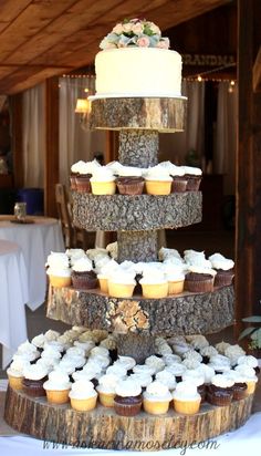 a three tiered cake with cupcakes on the bottom is displayed in an instagram