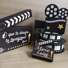 some black and white film strips are stacked on top of each other with gold stars