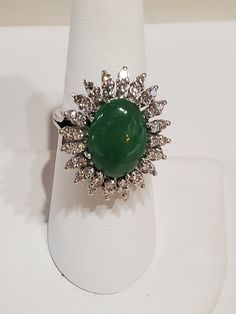 "Platinum Natural Green oval Cabochon Jade And Diamond Ring . The ring measures approx 12.79 grams. The ring size is approx. 6 1/2 can size up or down. The diamond measures .60ctw. The jade itself measures approx.10mm x 14mm oval shape. The ring itself measures approx.24mm x21mm oval shape. The ring marked plat. Inside means platinum. If you have any question send me a message... When listing and describing our items we make a conscious effort to over describe all imperfections and blemishes. Th Oval Diamond Cabochons For Formal Occasions, Luxury Multi-stone Oval Cabochons, Oval Diamond Cabochons With Polished Finish, Anniversary Diamond Cabochon, Formal Oval Cabochon Emerald Ring, Formal Emerald Cabochon Ring, Formal White Gold Emerald Ring With Oval Cabochon, Classic Oval Cabochons For Anniversary, Classic Oval Gemstone Cabochons