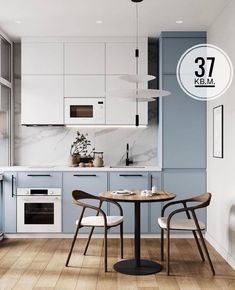 a white and blue kitchen with two chairs around a table in front of the stove