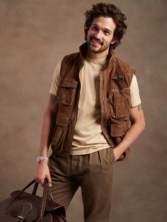 a man holding a brown bag and smiling