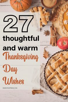 thanksgiving day wishes with pumpkins, apples and pies on a white wooden table