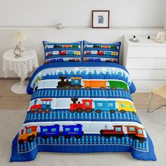 a bed room with a neatly made bed and a toy train on the coverlet