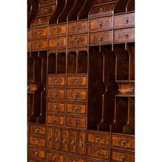 a large wooden cabinet with many drawers