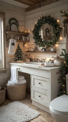 a bathroom decorated for christmas with wreaths and lights