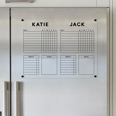 a stainless steel refrigerator with a planner on it