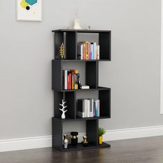 a black book shelf with books on it