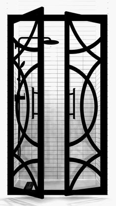 a black and white photo of an open door to a bath room with tiled walls