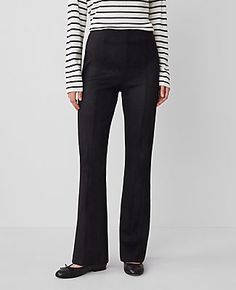 Elevate your wardrobe with the Ann Taylor Faux Suede Skinny Flare Pants, a chic blend of contemporary design and classic elegance. These pants are meticulously crafted to enhance your silhouette, featuring a high-rise waist that sits just below the natural waistline, and a flare leg that begins at the knee for a dramatically stylish finish.

- Size: 10
- Color: Black
- Material: 96% Polyester, 4% Spandex
- Fit: Tailored and fitted with a flared leg
- Length: Full length with a 31" inseam and 18 Elegant Flare Leather Pants For Fall, Fitted Flare Leather Pants For Work, Flare Pant, Dress Pant, Classic Elegance, Flare Pants, Effortless Style, Fit And Flare, Faux Suede