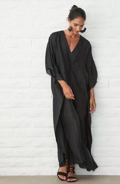 Placket Long Caftan - Women's V Neck Silk Dress – ocean+main Chic Tunic Maxi Dress For Loungewear, Oversized Long Sleeve Maxi Beach Dress, Oversized Long Sleeve Beachwear Maxi Dress, Oversized Long Sleeve Maxi Dress For Beachwear, Oversized Tunic With Kimono Sleeves For Beach Cover-up, Chic Flowy Kaftan For Beach Cover-up, Oversized V-neck Bohemian Tunic, Chic Flowy Kaftan With Kimono Sleeves, Chic Long Kaftan For Beach Cover-up