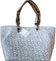 Chic Calvin Klein Bag, Chic Calvin Klein Double Handle Bag, Chic Calvin Klein Bag With Double Handle, Chic Calvin Klein Tote Bag, Chic Calvin Klein Shopping Bags, Calvin Klein Leather Bags For Daily Use, Chic Calvin Klein Bags For Shopping, Calvin Klein Leather Shopping Bags, Calvin Klein Shoulder Bag For Everyday