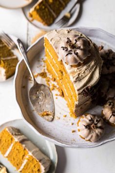 a piece of cake on a plate with a fork next to it and another slice in the background