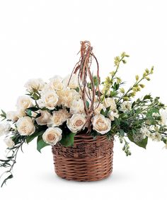 a wicker basket filled with white flowers