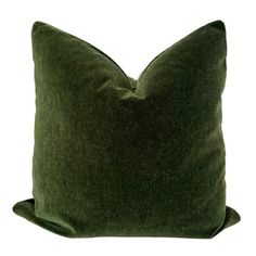 a green pillow on a white background