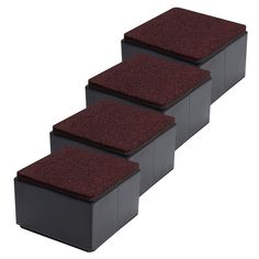 three black boxes with red carpeted steps on each side and four different colors for the top