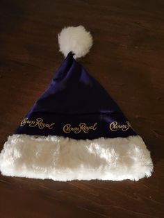 a blue and white hat on top of a wooden table