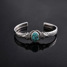 This stunning Silver Medieval bracelet is the perfect gift for any special occasion, especially as a unique birthday gift. Adorned with a vibrant turquoise gemstone, this bracelet exudes elegance and charm. Handcrafted with intricate details, this piece is sure to make a statement and be a beloved addition to any jewelry collection. Make a lasting impression with this exquisite bracelet that combines a touch of medieval inspiration with modern style. Perfect Gift for Birthday - Anniversary and L Bohemian Bangle Jewelry For Anniversary, Handmade Bohemian Bracelets For Anniversary, Adjustable Bohemian Bangle For Anniversary, Blue Bracelet With Intricate Design As A Gift, Spiritual Cuff Bracelet With Intricate Design As Gift, Vintage Turquoise Bracelets As Gift, Spiritual Cuff Bracelet With Intricate Design For Gift, Bohemian Cuff Bracelet With Intricate Design As Gift, Spiritual Turquoise Bangle As Gift