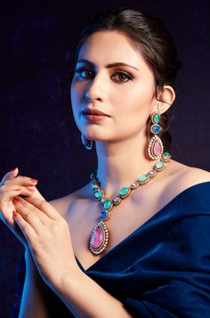 Elegantly blending classic and contemporary styles, this necklace set exudes a timeless and regal presence that is sure to capture attention. Perfect for any special occasion, its combination of traditional charm and modern elegance makes it the perfect accessory to elevate your ensemble. Finish: 22KT Gold Plating Material: Silver, Copper Alloy, Polki, Crystals Color: Multicolored Size: Free Size, Adjustable Closure Type: Draw String Box Contains: 1 Necklace, 1 Pair Earrings Hand Set Jewelry Sets For Reception, Exquisite Bridal Necklace For Festive Season, Elegant Temple Necklace With Matching Earrings, Fusion Style Festive Jewelry Sets With Elegant Design, Elegant Jewelry Sets With Intricate Pendant Design, Festive Kundan Necklace With Matching Earrings For Formal Occasions, Elegant Multicolor Jewelry Sets For Weddings, Festive Jeweled Temple Necklace, Elegant Multicolor Necklaces For Formal Occasions