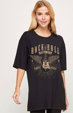 Details: Black Rock & Roll World Tour Graphic Tee Fabric has stretch True to size for a relaxed fit Feel the thrill of rock and roll with this stylish black tee! The tan lettering stands out against the bold fabric, reading "Rock & Roll World Tour Free Soul", featuring an awesome guitar, wings, and lightning bolts design. Material and Care: 100% Cotton Color may vary on different viewing devices Dry Clean or Machine Wash Cold on gentle cycle, hang to dry. Sizing Info: Small 2-6 Medium 8-10 Large 12-14 XLarge 14-16 Model is 5'8 and wearing a small. Celia is 5’5, 34D, size 9/10 in bottoms and is between a medium/large in tops. She wears the medium. Bold Fabric, Lightning Bolt Design, Rocker Tee, Lightning Bolts, Free Soul, Rock Tees, Black Rock, Rock Roll, Girls Rock