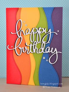 a birthday card with the words happy birthday written on it and rainbows in the background