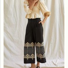 With An Abstract, Tonal Motif, These Wide-Legs Bring A Dash Of Artful Flair To Your Seasonal Wardrobe. Pair Them With A Sweetly Ruffled Blouse For An Ensemble That’s Destined To Thrill. Cottonembroidered Embellishmentside Slant Pocketswide-Leg Silhouettefront Zip Dimensions12" Rise26" Inseam32" Leg Openinginside Label Marked To Prevent Store Returns Elegant Black Bottoms With Floral Embroidery, Chic Embroidered Wide Leg Pants, Chic Embroidered Straight Pants, Chic Wide Leg Embroidered Pants, Chic Embroidered Summer Pants, Elegant Embroidered Summer Pants, Elegant Floral Embroidery Trousers, Chic Embroidered Trousers, Chic Fitted Bottoms With Floral Embroidery