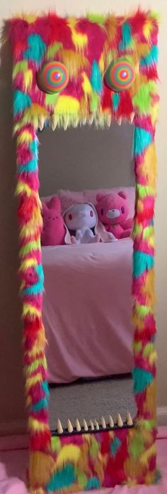 a bed made out of fake fur with stuffed animals on it's head and legs