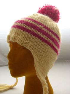 a knitted hat with pink and white stripes