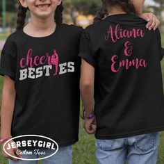 Create your own personalized cheer best friends shirts with our cheer besties shirts! Personalize the back with you and your cheer bestie's names, and choose your glitter colors to match your gym colors or you and your cheer bestie's favorite colors. If you have more than one cheer bestie, you can add up to three names!  Enter your personalization under "Add your personalization."  Back: enter your cheerleaders' names in the order you would like them to appear on the back of your cheer besties shirts.  Enter 2 glitter design colors for your bowling mom shirt: 1 glitter color for "cheer" and the cheerleader detail on the front, and your cheerleaders' names on the back; and 1 glitter color for "besties" on the front.  See a full list of our available glitter design colors options here: http: Cheer Base Shirts, School Spirit Tops With Glitter Print For Cheerleading, Cheer Besties Shirts, Customizable Black Tops For Cheerleading, Customizable Black Top For Cheerleading, Sports Season Cheerleading T-shirt With Team Name, Cheap Cheerleading T-shirt With Team Name, Team Spirit T-shirt With Glitter Print For Cheerleading, Custom Print T-shirt For Cheerleading