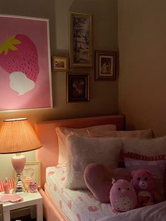 a bedroom with a pink strawberry painting on the wall next to a bed and night stand