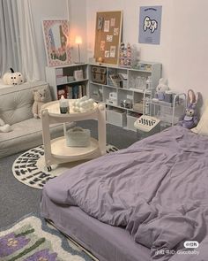 a bed room with a neatly made bed next to a book shelf filled with books