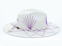 White Palm Straw Hat with Purple TCU Inspired Design on Brim by Corazon Playero. Custom designed and hand made hats by artisans in San Jose Del Cabo, Mexico. These hats are one size fits most with an elastic band inside to add comfort and fit for all head sizes. Each hat has a 3-4 week turnaround. Please note, all hats come with natural braid unless custom braid is purchased. White Handmade Fedora For Rodeo, Handmade White Fedora For Rodeo, Artisan White Fedora Straw Hat, White Toquilla Straw Panama Hat For Festivals, White Artisan Straw Hat With Short Brim, White Artisan Fedora With Adjustable Fit, Artisan White Fedora For Festivals, Artisan White Wide Brim Straw Hat, Handmade White Bucket Hat