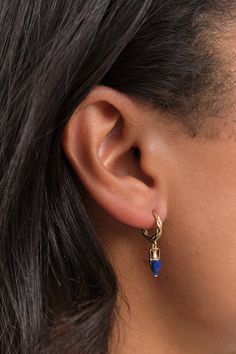 The Inlay Vessel Huggie showcases a meticulous hand-carved design, adorned with a vibrant lapis inlay. Suspended from an elaborately braided 14k gold hoop, it adds a touch of elegance to any accessory collection. Tea Container, Farmhouse Pottery, Tassel Scarf, Pamela Love, Bar Accessories, Gold Hoop, The Body Shop, Earring Necklace, Sock Shoes