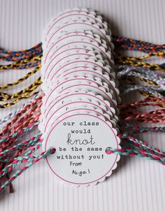 there are many different colored braids on the table with a tag that says, our glass would not be made without you from them